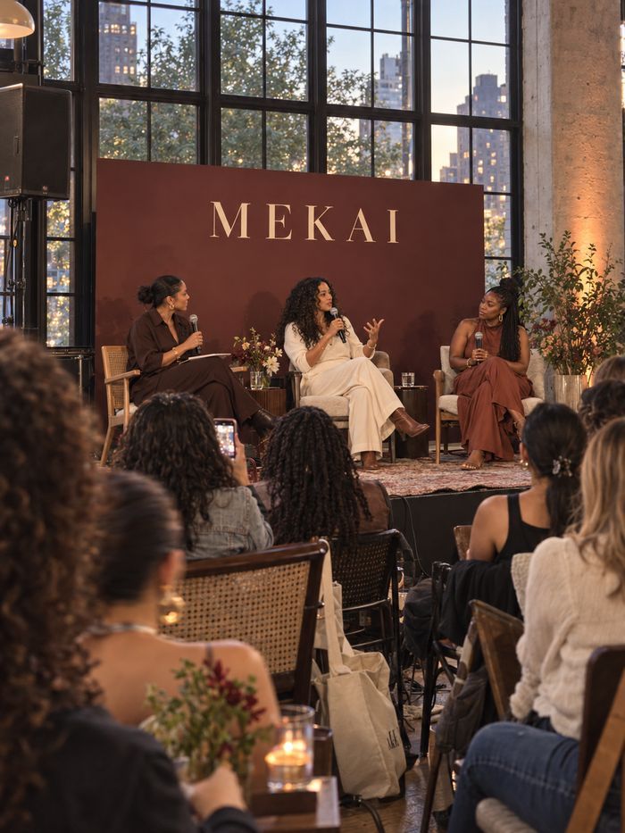 Panel discussion on stage at a branded event